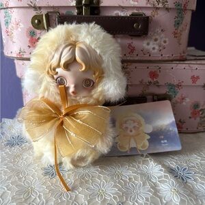 Adorable Plush Doll with Golden Bow